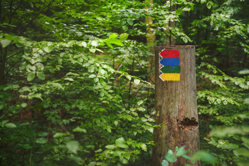 Red, blue, green and yellow direction signs of the Czech Hiking Markers System. This system spread through Central Europe and Eastern Europe and even to countries outside Europe.