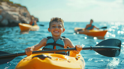 Portrait of children kayaking in tropical sea water