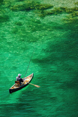 Aerial view of a person kayaking in sea water