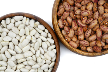 white and red beans in two wooden bowls on a white background