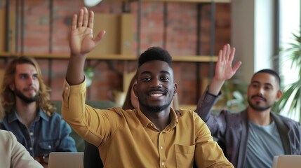 Young colleagues raising hands to ask questions during business meeting in office. Diverse business people voting at the conference in meeting room listening their young male