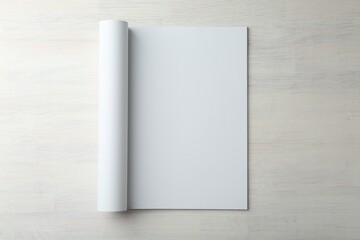 Open magazine with blank page on light wooden table, top view. Mockup for design