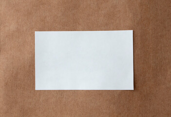 Blank paper sticker label isolated on brown paper background