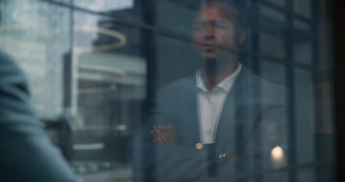 Black man, window or reflection in office for business, financial decision or thinking. Male CEO, brainstorming or arms crossed or confident for corporate planning, company development or career
