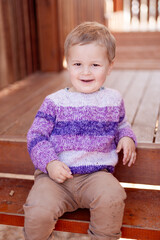 child sitting on a bench