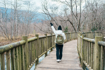 Woman tourist travel Kamikochi National Park, happy Traveler sightseeing nature, Nagano Prefecture, Japan. Landmark for tourists attraction. Japan Travel, Destination and Vacation concept