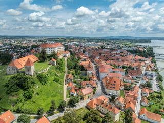 Aerial view of Ptuj castle with red roof gothic renaissance palace building, bastions, towers on a...
