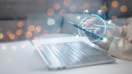 Content marketing concept, a woman is using a tablet to type on a laptop with a content icon.