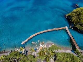 tropical island with boat. tropical island beach in the ocean with trees. mountain beach view with clear sky.