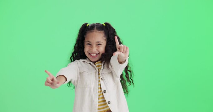 Happy, girl and dance as child by green screen background with hand movement, energy and music for celebration. Excited, kid and hip hop steps, winner and performance achievement as dancer of mockup