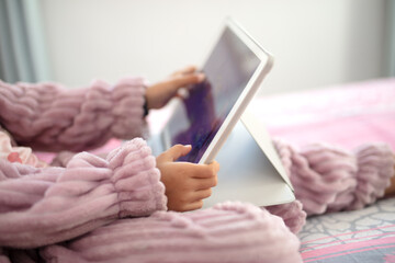 Little girl's summer entertainment life watching iPad
