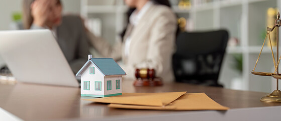 Real estate consultation with diverse female lawyers in office