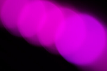 Blurred lights with purple bokeh effect Background