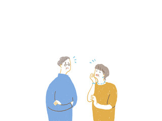 困った顔をするシニア男性とシニア女性