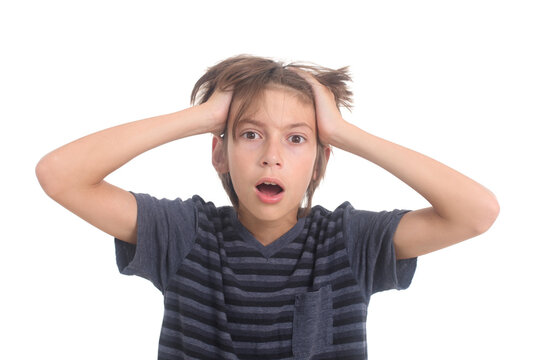 stressed out and shocked preadolescent boy on white background 