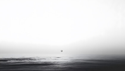 A mostly blank background with a small, centered design, like a tiny star or dot, emphasizing simplicity and space