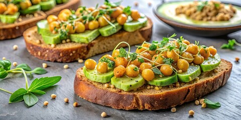 Gourmet avocado chickpea toast on artisanal bread with avocado slices, spiced chickpeas, and microgreens