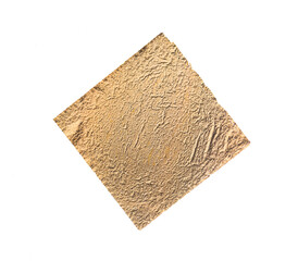 Crumpled gold leaf isolated on a white background