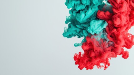 Obraz premium Vibrant swirl of turquoise and red ink creating stunning abstract patterns in water, perfect for artistic projects and backgrounds.