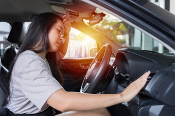 Hand checking the air conditioner in the car, The cooling system in the car. Girl driver being hot...
