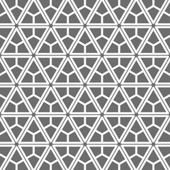 Seamless geometric pattern with hexagonal and triangular shapes consisting of intertwined lines. Suitable for backgrounds, textiles or graphic design elements.