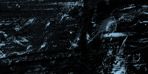 Fototapeta premium Abstract Dark black stone wall grunge aged rough texture background. closeup texture of black color. black concrete cracked walls in the background. blue and black messy wall stucco texture background