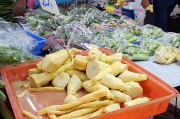 Pile of bamboo shoots in a tray sale on the table in the market