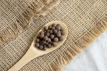 Jamaica pepper on white background, traditional spices. allspice close-up. selective focus, allspice.