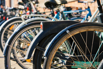 Many bicycles parked at a public bike rack in Copenhagen. Bike parking in Copenhagen. Concept of...