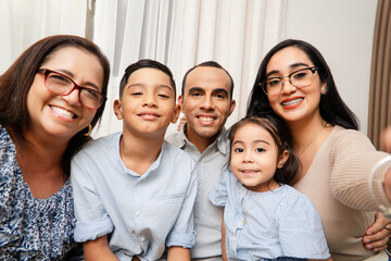 Hispanic Family together taking a selfie. Perspective personal