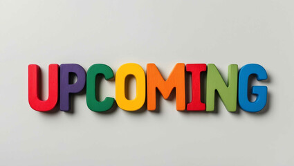 upcoming events word colorful wooden letters on plain white background