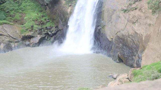 waterfall in the mountains, water flow to river , water on rock mountain 