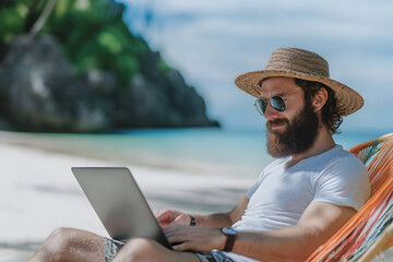 Fototapeta premium An IT man working with a laptop during his vacation