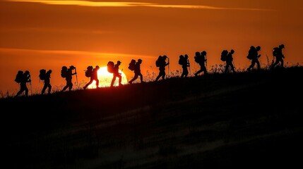 Fototapeta premium Silhouetted figures standing along a dividing line against a dusk sky background