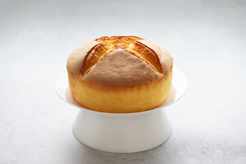 Japanese cheesecake on a white plate, selective focus