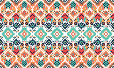 Ikat seamless pattern,geometric design,motif ethnic handmade, Ikat ethnic tribal,boho colors seamless wallpaper. for background,fabric,wrapping,clothing,wallpaper,batik,carpet,embroidery style.