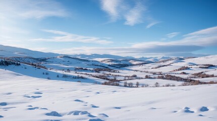 Scenic winter view of snowy hills under azure sky 