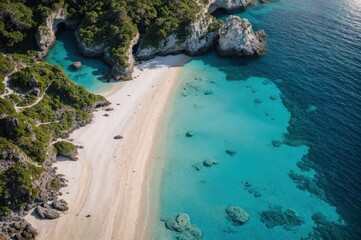 Serene beach follows the turquoise sea amidst verdant foliage and rocky cliffs 