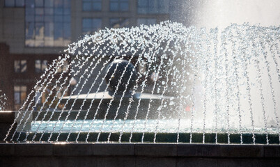 Splashes of water in a fountain as a background