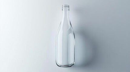 Fototapeta premium A clear glass bottle displayed against a minimalist background.