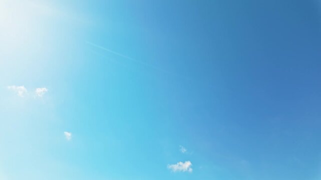 Slow pan from sky to beach of Daymer Bay, Cornwall, UK on sunny day