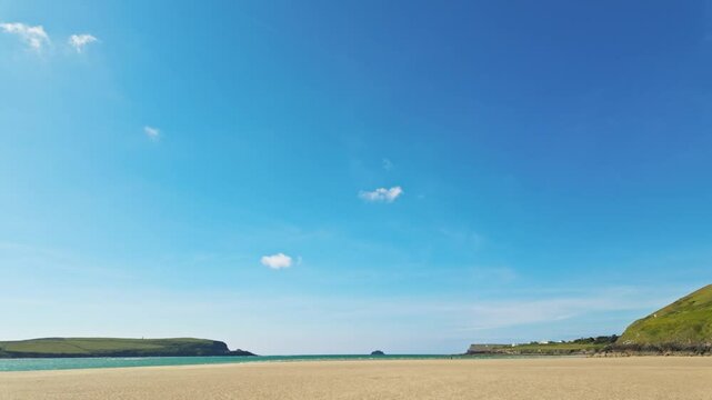 Slow pan from beach to horizon of Daymer Bay, Cornwall, UK