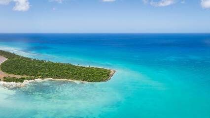 Aerial view of Saona Island. Caribbean Sea with clear blue sea, sandy beach and green palms. Tropical beach.Dominican Republic