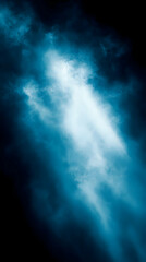 Fototapeta premium A beam of light shines through a dark blue cloudy sky.