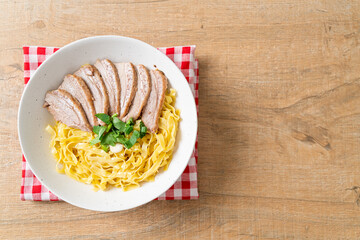 dried duck noodles in white bowl