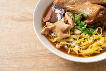 egg noodles with stewed and braised duck in brown soup