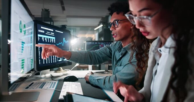 Currency, graphs and business people with discussion in office for investment, solution and finance update. Investor, man and woman with tech for crypto mining, support and review of trading signals