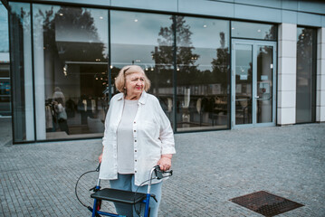 Elderly woman walking on city street with rollator, running errands.