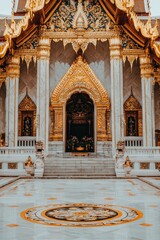 Golden Temple Entrance with Intricate Details and Marble Floor