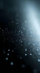 Abstract black background with light bokeh.